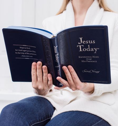 Jesus Today large deluxe devotional being held by a woman