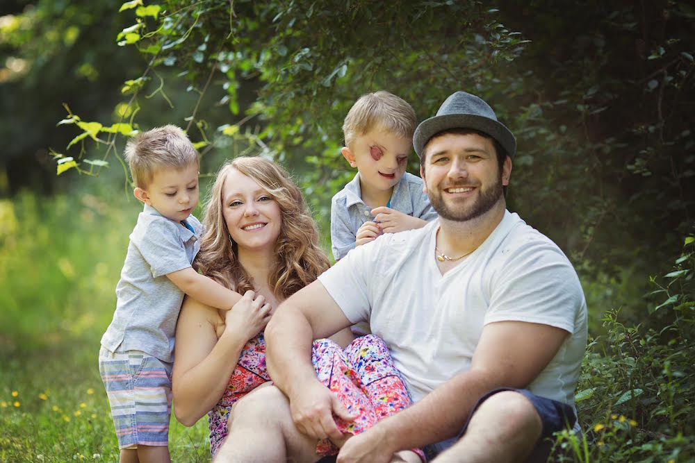 Lacey Buchanan with her husband and two sons.