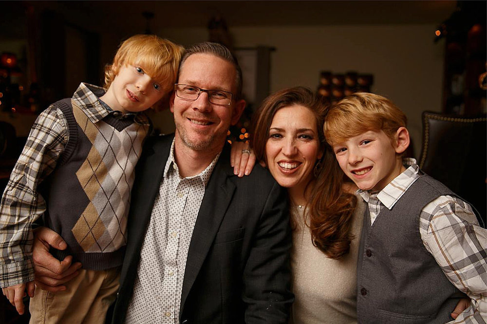 Maria-Jose Tennison poses for a photo with her husband and two sons.