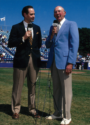 Ernie Johnson, Jr. with his dad on the field.