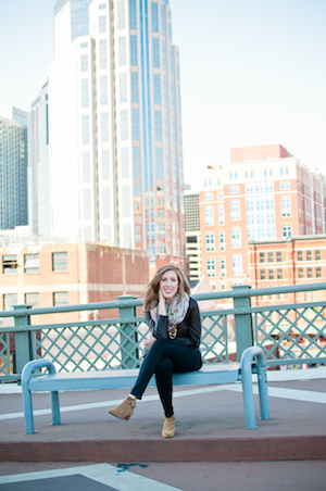 Andrea Lucado sits on a bench in the city.