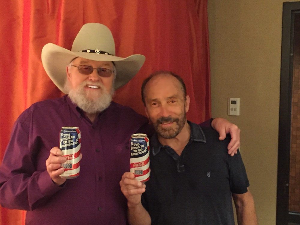 Lee Greenwood and Charlie Daniels posing for a picture together.