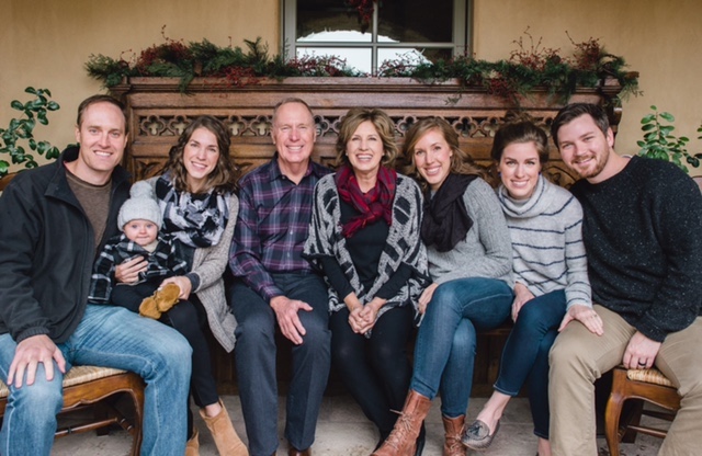 Max Lucado posing for a picture with his family.