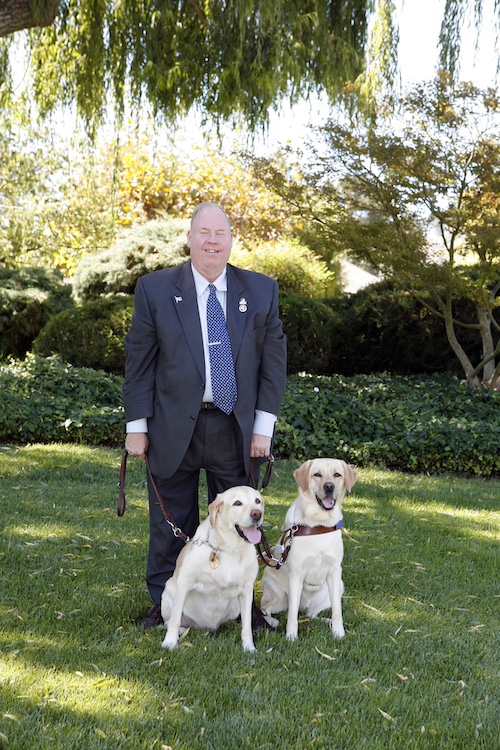 Jesus Calling podcast 419 featuring Michael Hingson & Eve Selis - Hingson shown here with his two guide dogs