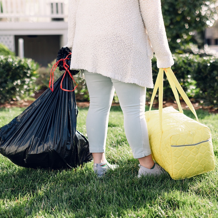 Jesus Calling podcast 429 featuring Adrien Lewis and Cara Finger - image with trash bag that foster children used to carry their belongings & the new My Bag My Story duffel bag