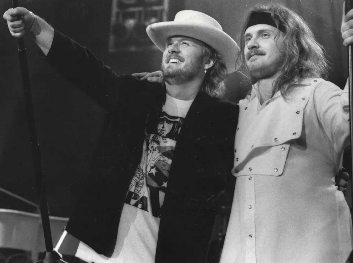 Jesus Calling podcast 447 featuring Johnny and Donnie Van Zant - Van Zant Brothers - Lynyrd Skynard and 30 Special - black and white image while on stage