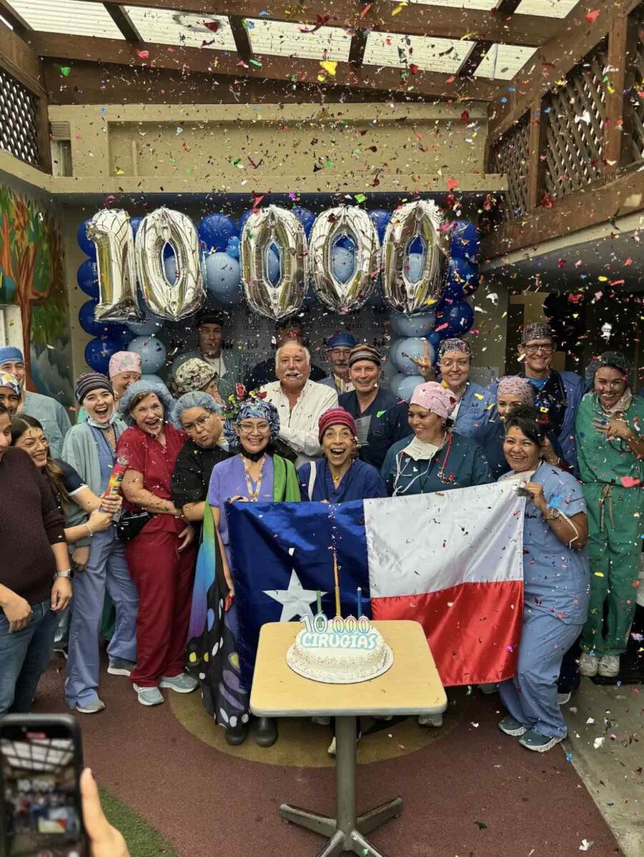 Jesus Calling podcast 448 featuring Steve Moore - founder of The Shalom Foundation - shown with workers celebrating 10000