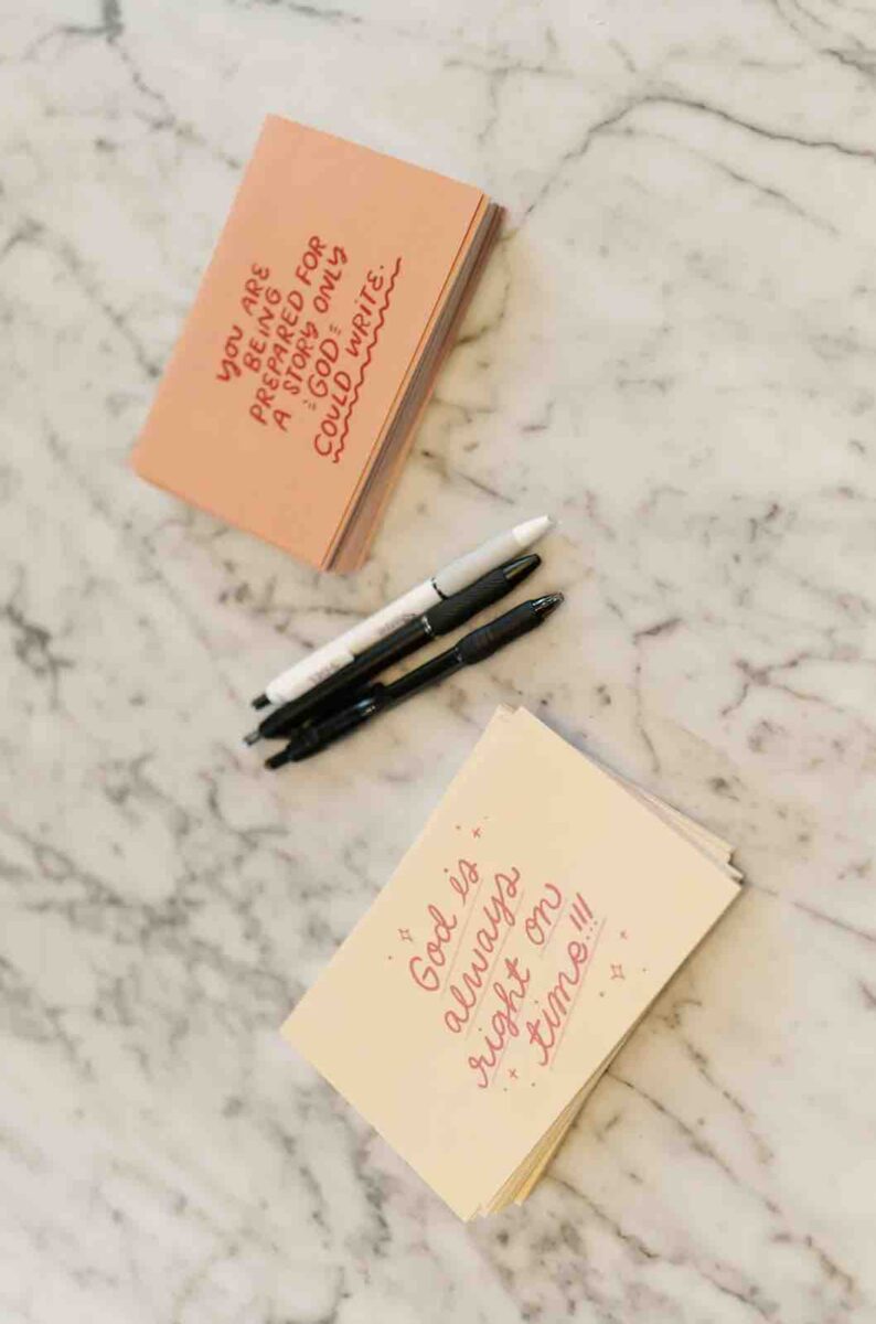Jesus Calling podcast 458 featuring Hope Reagan Harris - Purpose Doesn't Pause - shown here are pens and postcards