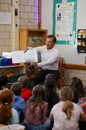 Jesus Calling 476 podcast featuring JT Mestdagh - shown here 2025 JT reading to kids