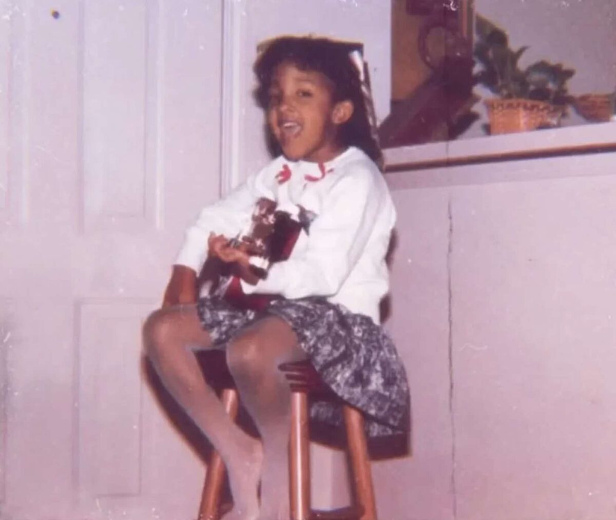 Jesus Calling podcast 475 featuring Mickey Guyton - shown as a young girl playing guitar and singing