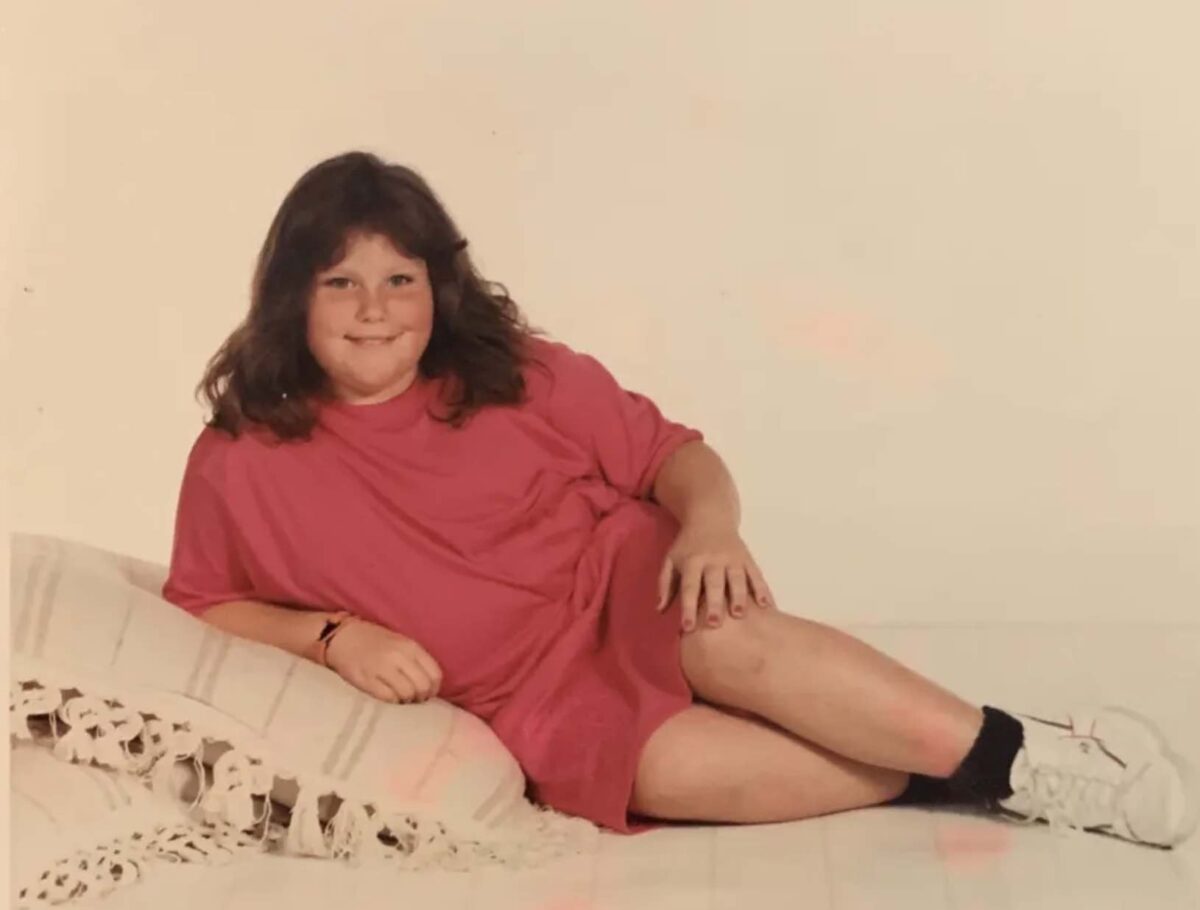 Jesus Calling podcast 477 featuring Chrissy Metz - shown here laying on a pillow
