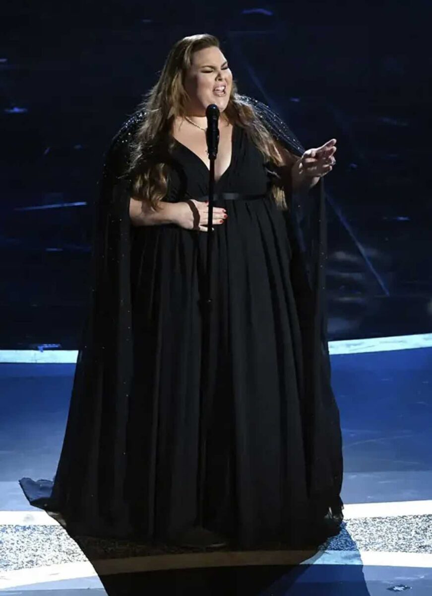 Jesus Calling podcast 477 featuring Chrissy Metz - shown on stage singing